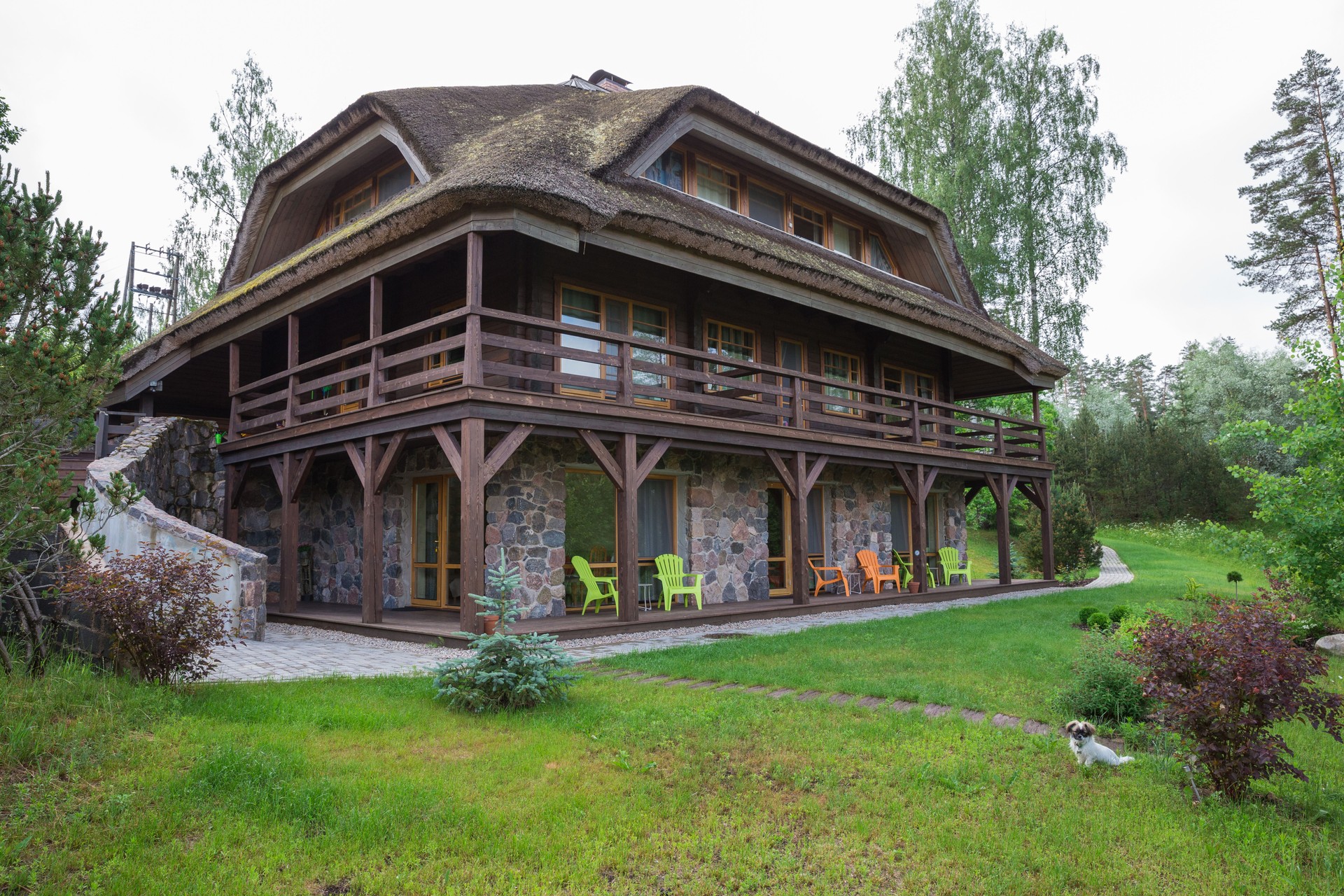 City Amatciems, Latvian republic. Guest house and green courtyard. Home facade and exterior. Travel photo 14. Jun. 2019